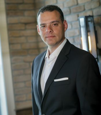 Portrait of Russell Volk, REALTOR®.