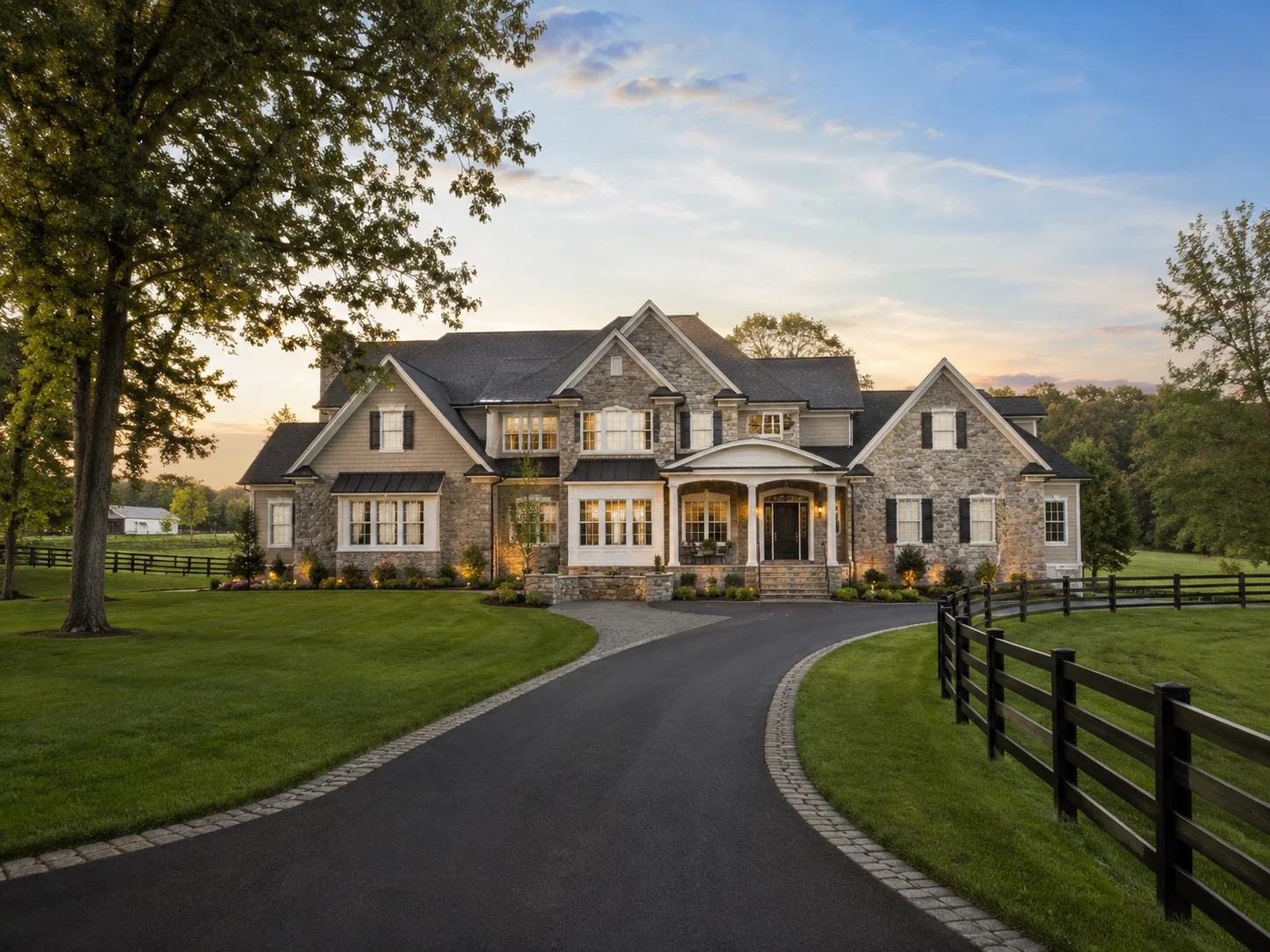 Luxury home in Buckingham PA with large lawn, mature trees and a curved driveway