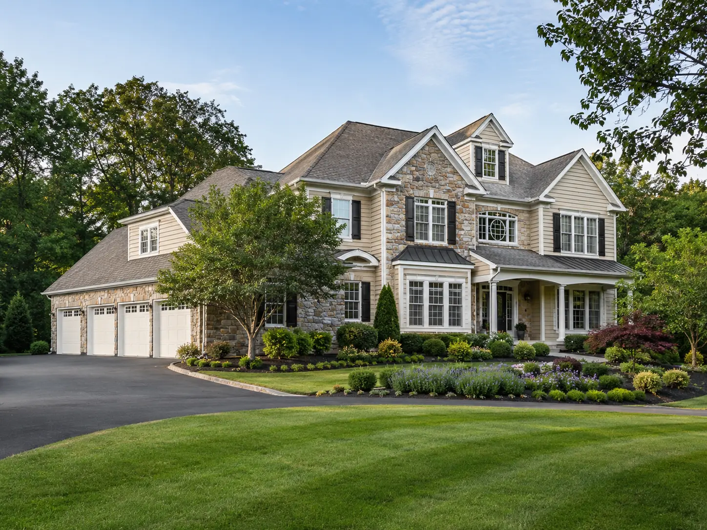 Luxury home in an upscale Chalfont area community with stone exterior, manicured landscaping, and a spacious front lawn