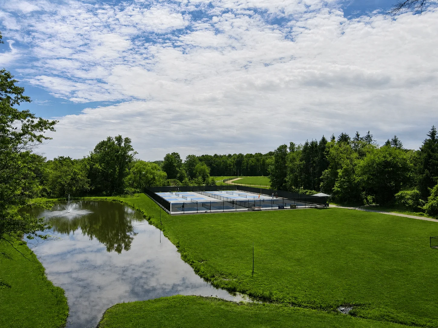 Guinea Lane Park in Jamison, PA, with pond, open field, and natural surroundings.