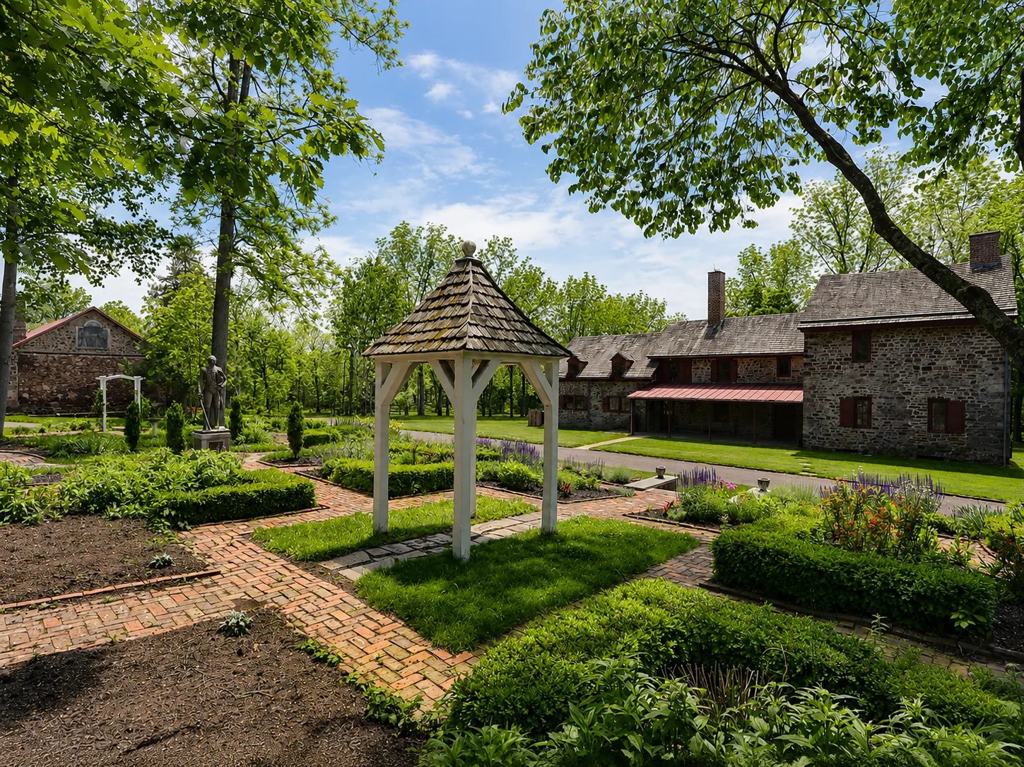 Moland House Historic Park in Jamison, PA, with historic buildings, gardens, and mature trees.