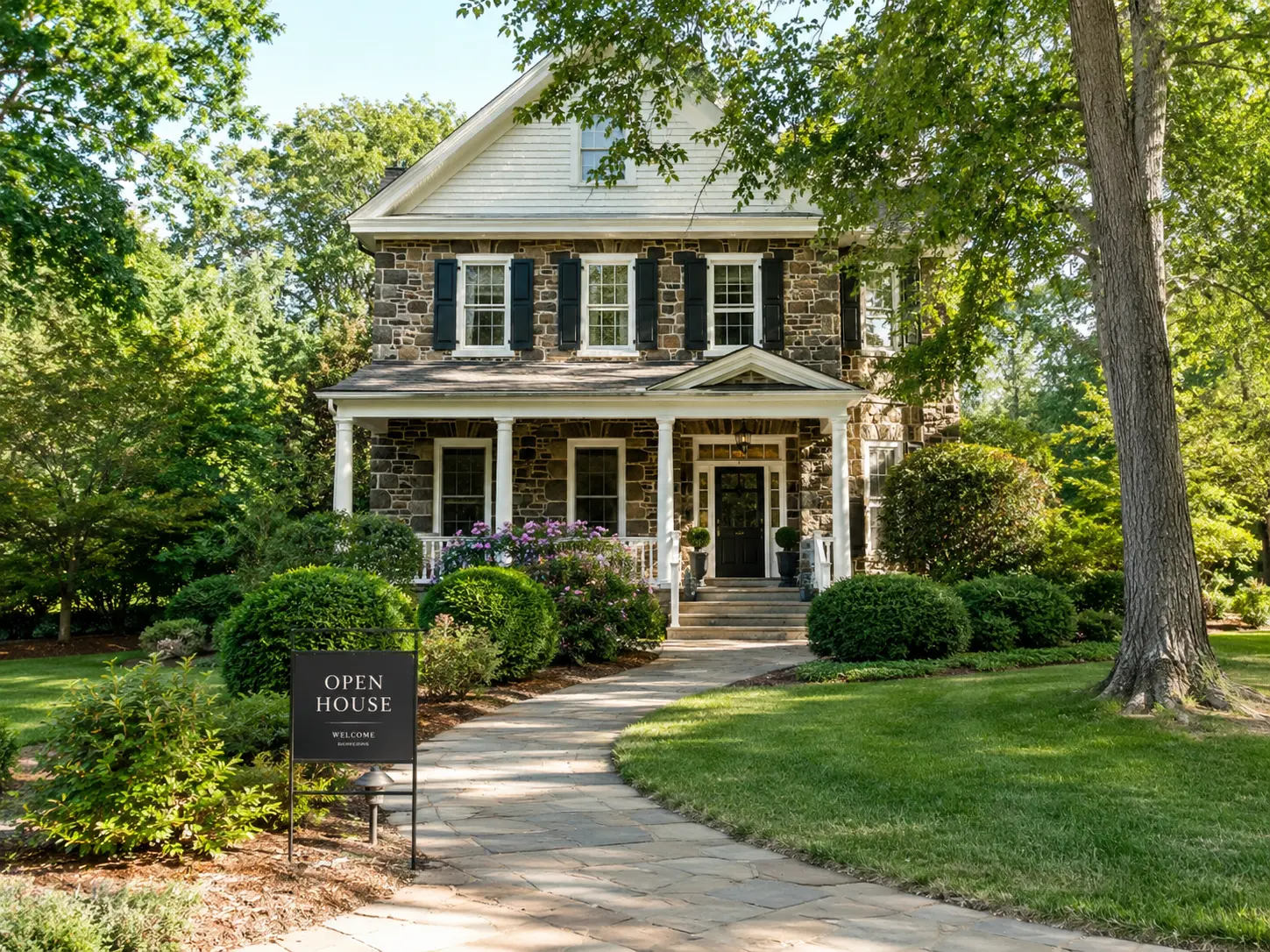 Open house sign in front of a charming stone home in New Hope PA