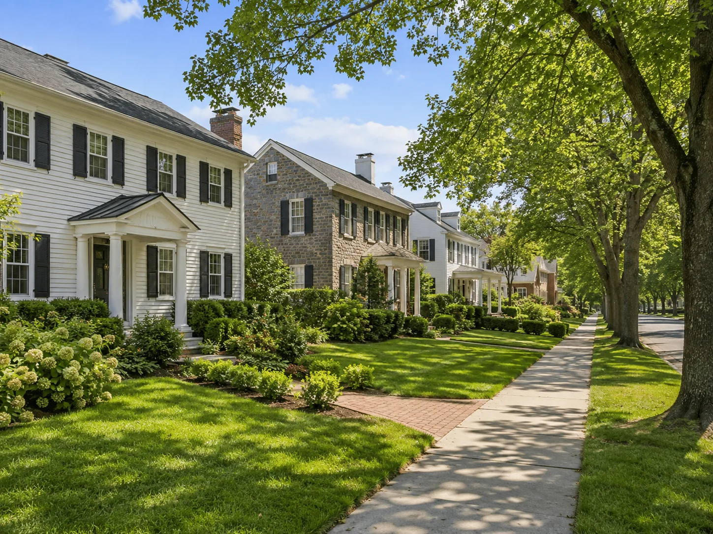 Tree-lined Newtown PA neighborhood with well-kept homes and sidewalks