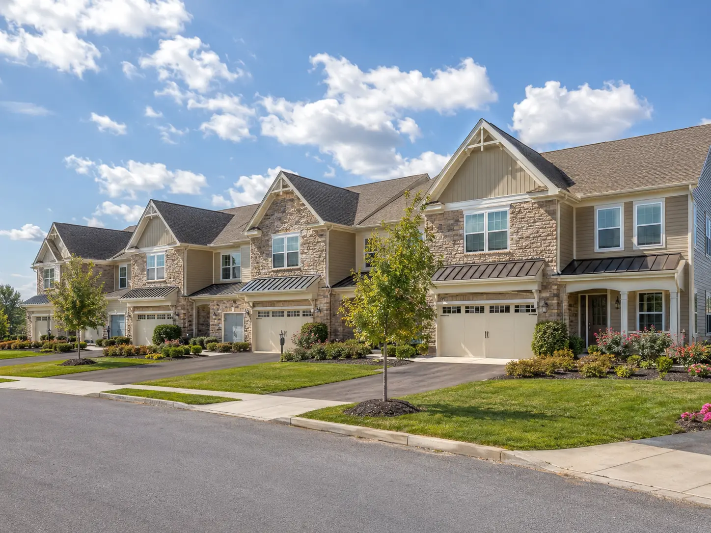 Warminster 55+ townhomes with attached garages and landscaped sidewalks