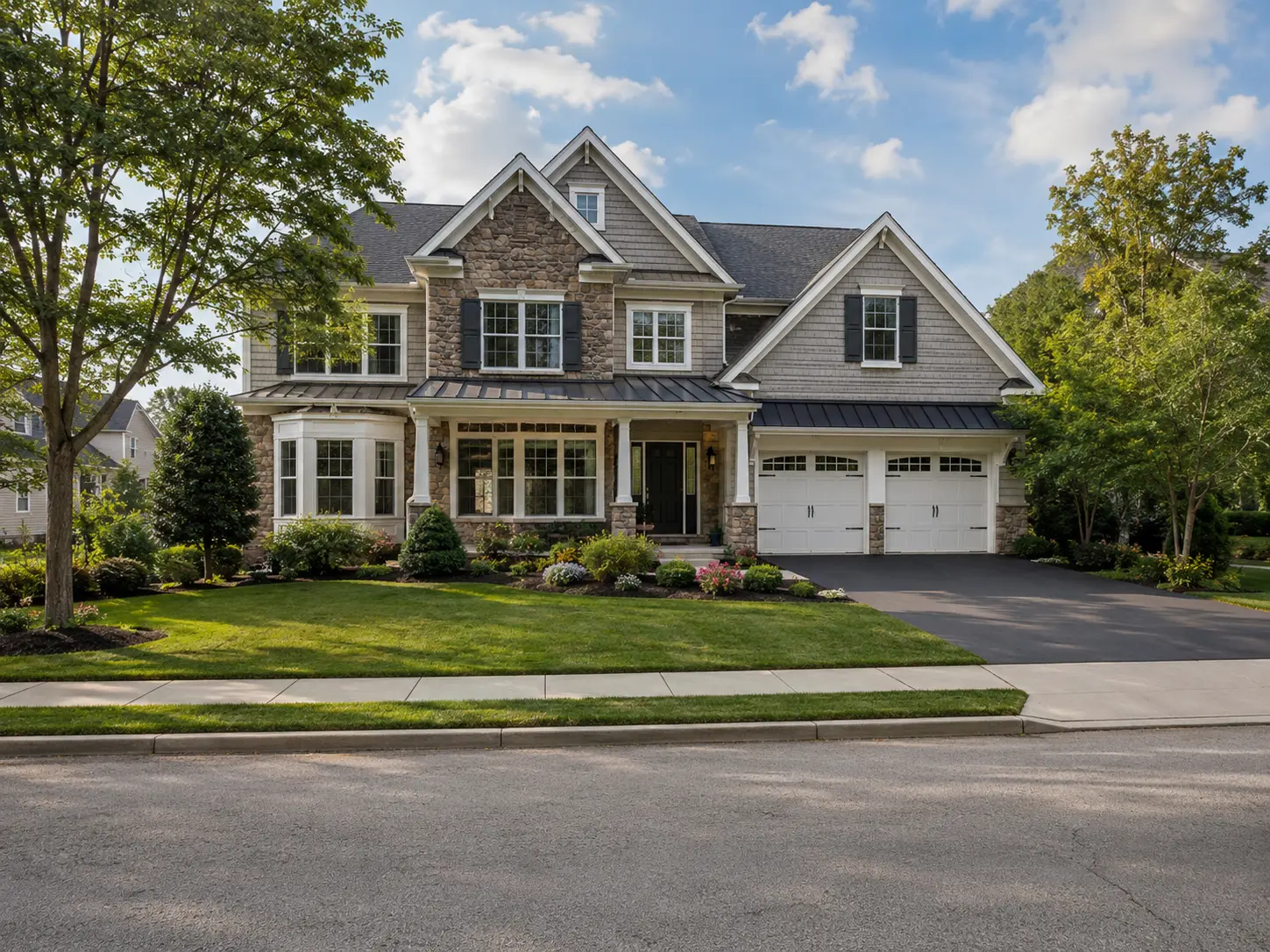 New construction single-family home in Yardley with stone exterior and landscaped front yard